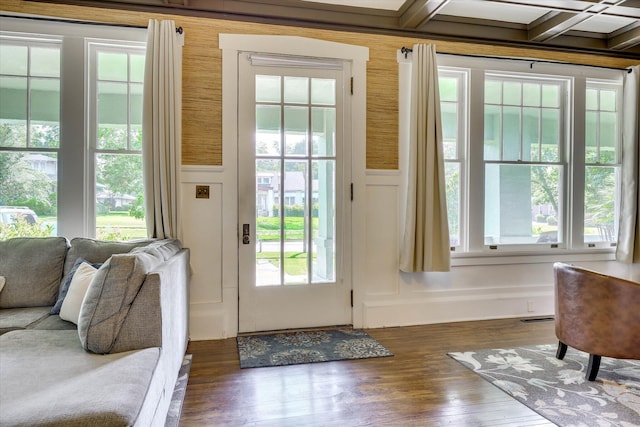 413 S Liberty St, Waynesboro, GA 30830 - doorway with a decorative wall, wood finished floors, a wainscoted wall, and beam ceiling