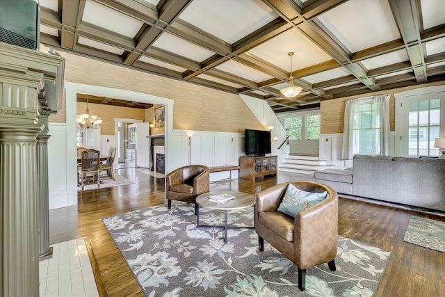 413 S Liberty St, Waynesboro, GA 30830 - living room with coffered ceiling, a chandelier, hardwood / wood-style floors, beamed ceiling, and a decorative wall