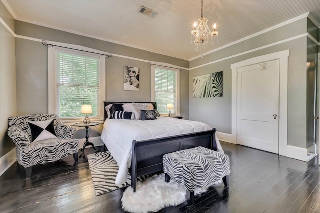 413 S Liberty St, Waynesboro, GA 30830 - bedroom with a chandelier, ornamental molding, dark wood-style floors, and baseboards
