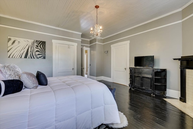413 S Liberty St, Waynesboro, GA 30830 - bedroom with a chandelier, wood finished floors, baseboards, and ornamental molding