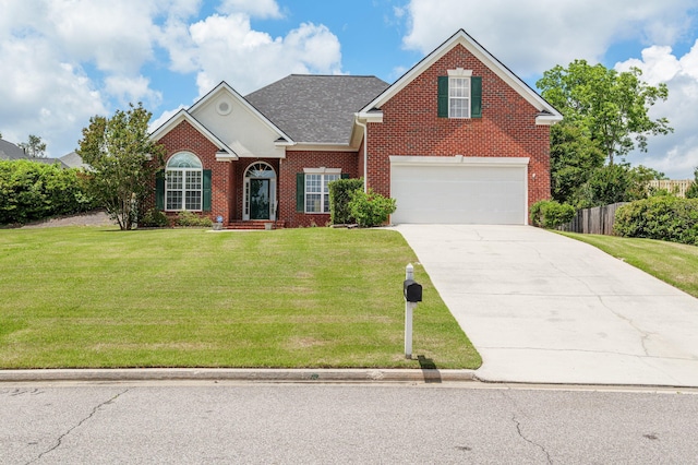 703 Talon Ct, Evans, GA 30809 - traditional home featuring brick siding, driveway, an attached garage, and a shingled roof