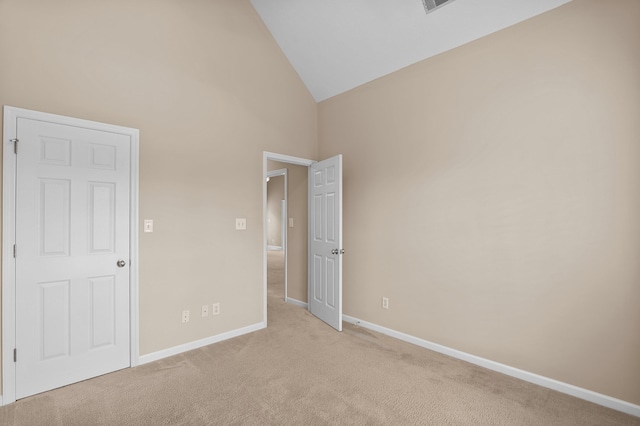 703 Talon Ct, Evans, GA 30809 - unfurnished bedroom with light colored carpet, baseboards, and high vaulted ceiling