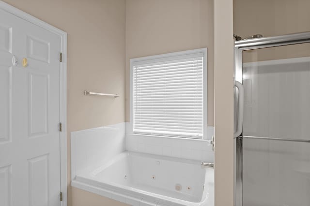 703 Talon Ct, Evans, GA 30809 - bathroom featuring a tub with jets and a shower stall