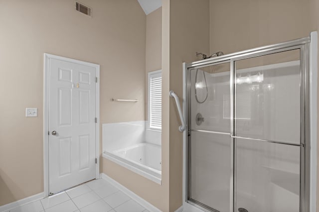 703 Talon Ct, Evans, GA 30809 - full bathroom with a stall shower, a bath, tile patterned flooring, vaulted ceiling, and baseboards