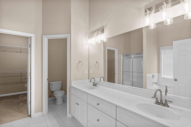 703 Talon Ct, Evans, GA 30809 - full bath with toilet, tile patterned floors, double vanity, and a spacious closet