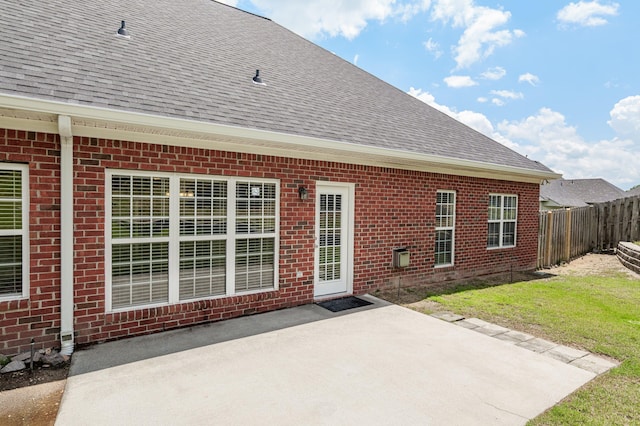 703 Talon Ct, Evans, GA 30809 - rear view of property with a shingled roof, brick siding, and a patio