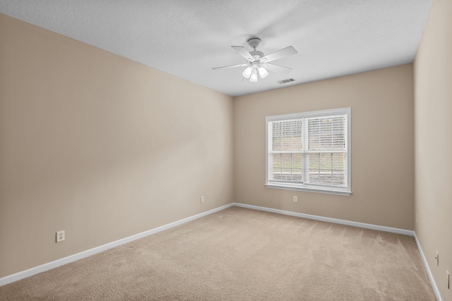 703 Talon Ct, Evans, GA 30809 - empty room with light colored carpet, a ceiling fan, baseboards, and a textured ceiling