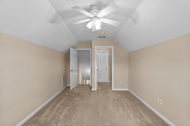 703 Talon Ct, Evans, GA 30809 - additional living space with light colored carpet, vaulted ceiling, baseboards, and a ceiling fan