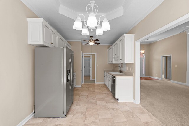 703 Talon Ct, Evans, GA 30809 - kitchen with stainless steel appliances, a chandelier, a tray ceiling, ornamental molding, and a sink