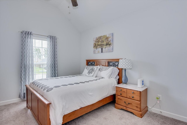 carpeted bedroom with ceiling fan and vaulted ceiling