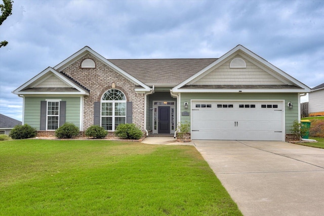 view of front of house with a garage and a front yard