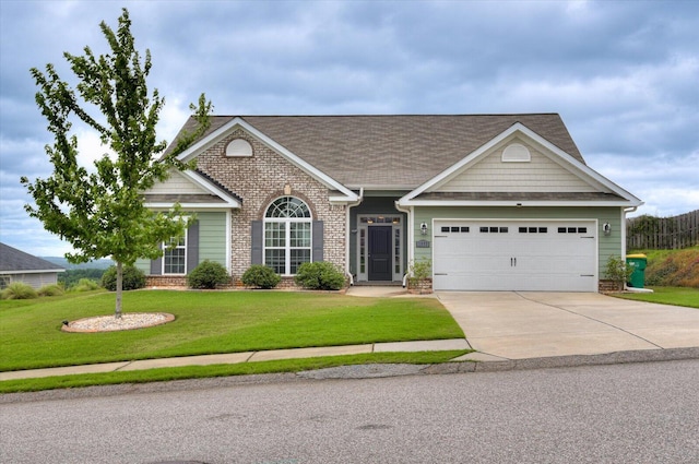 view of front of house with a garage and a front yard