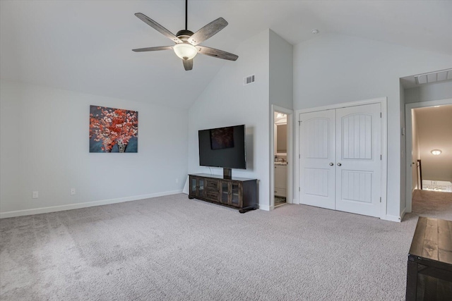 living room featuring carpet flooring, ceiling fan, and high vaulted ceiling