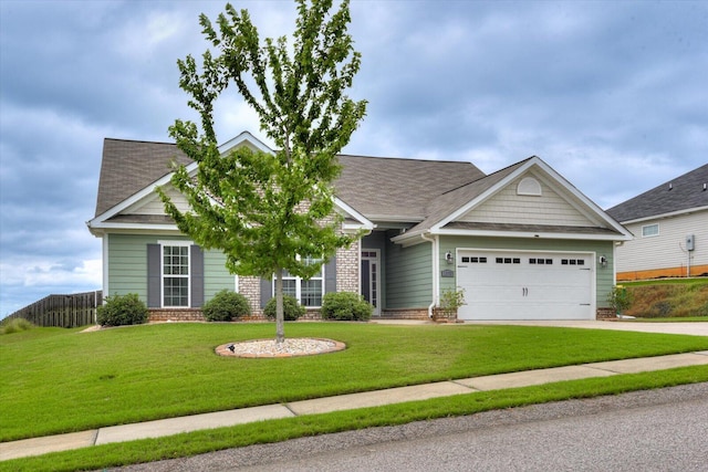 craftsman inspired home featuring a front yard and a garage