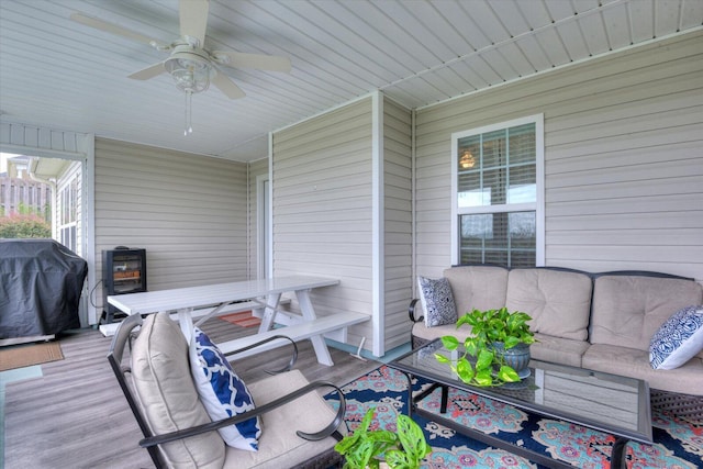 exterior space featuring area for grilling, ceiling fan, and an outdoor living space