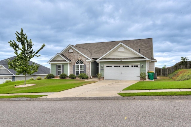 view of front of property featuring a front yard and a garage