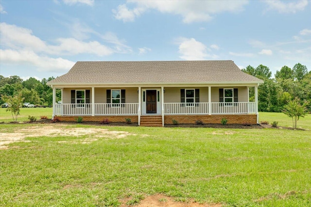 view of front facade with covered porch and a front yard