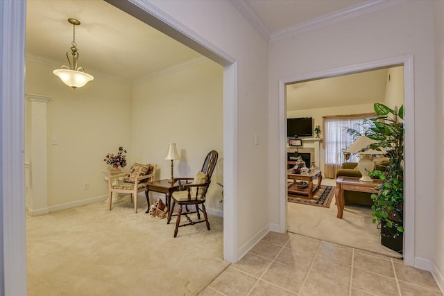 hallway with carpet, crown molding, and baseboards