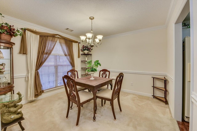 dining area with light carpet, visible vents, an inviting chandelier, and a textured ceiling