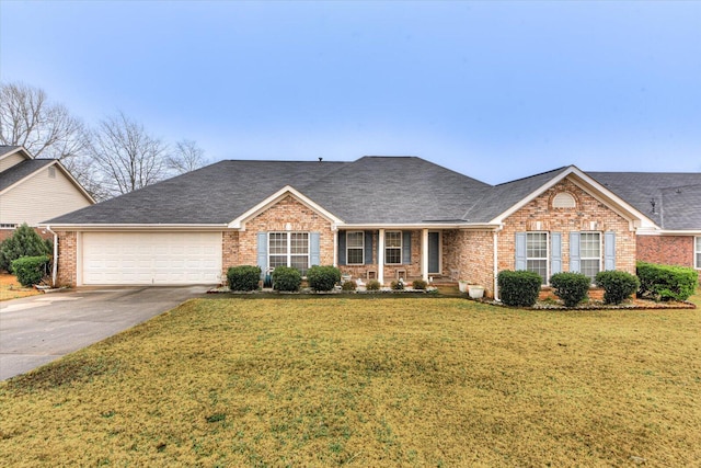 single story home featuring an attached garage, a front lawn, brick siding, and concrete driveway