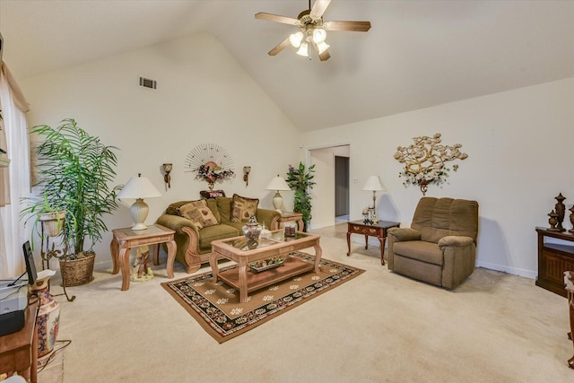 living area featuring baseboards, visible vents, light colored carpet, a ceiling fan, and high vaulted ceiling