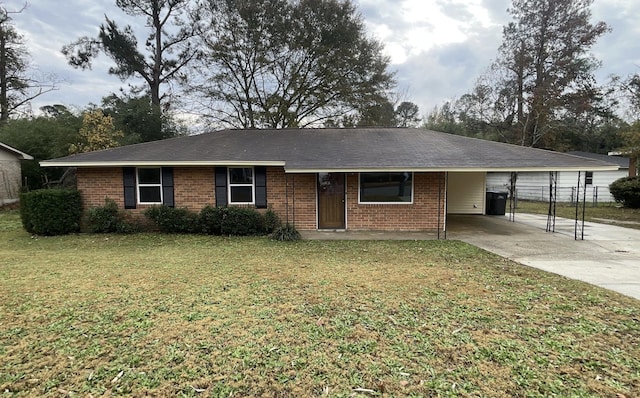 ranch-style house with a front yard and a carport