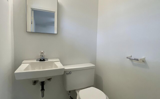 bathroom with toilet and sink