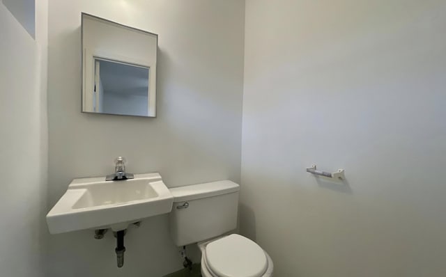 bathroom with sink and toilet