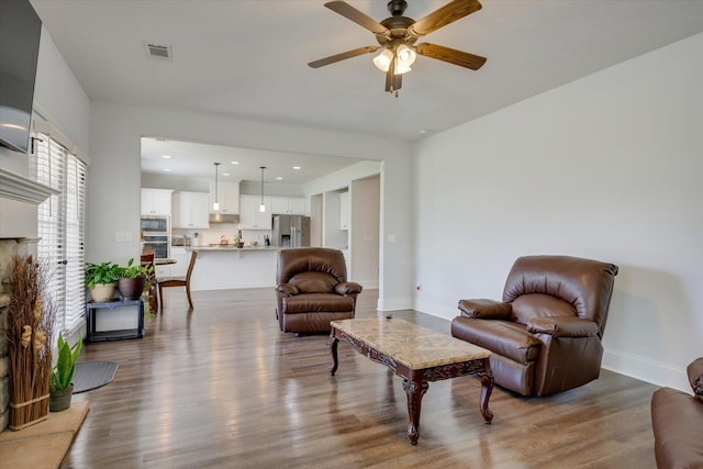 203 Preston Ct, North Augusta, SC 29860 - living area with baseboards, a ceiling fan, wood finished floors, and visible vents