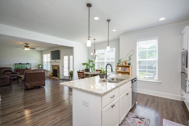 203 Preston Ct, North Augusta, SC 29860 - kitchen featuring a sink, a fireplace, a kitchen island with sink, open floor plan, and dark wood-style floors