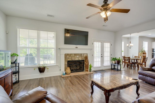 203 Preston Ct, North Augusta, SC 29860 - living room featuring a healthy amount of sunlight, ceiling fan with notable chandelier, and visible vents