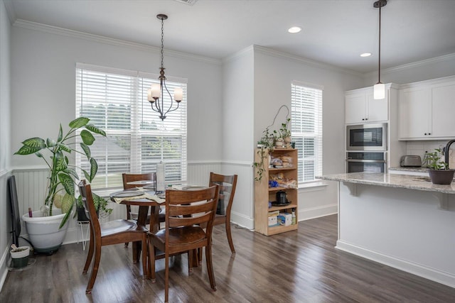 203 Preston Ct, North Augusta, SC 29860 - dining space featuring ornamental molding, a wainscoted wall, and dark wood-type flooring