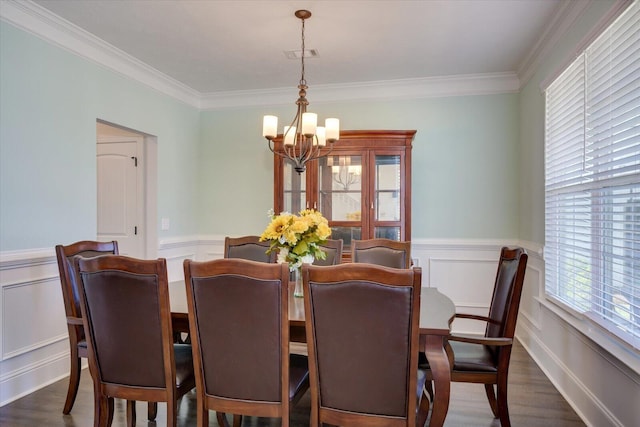 203 Preston Ct, North Augusta, SC 29860 - dining room featuring crown molding, a notable chandelier, wainscoting, and plenty of natural light