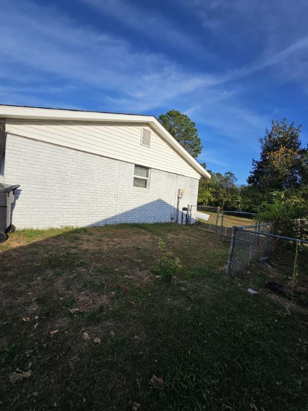 view of home's exterior featuring a yard