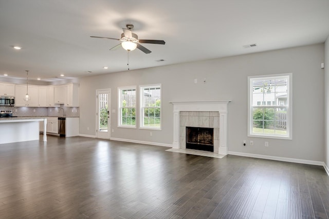 215 Palisades Rdg, Evans, GA 30809 - unfurnished living room featuring healthy amount of natural light, ceiling fan, recessed lighting, and baseboards