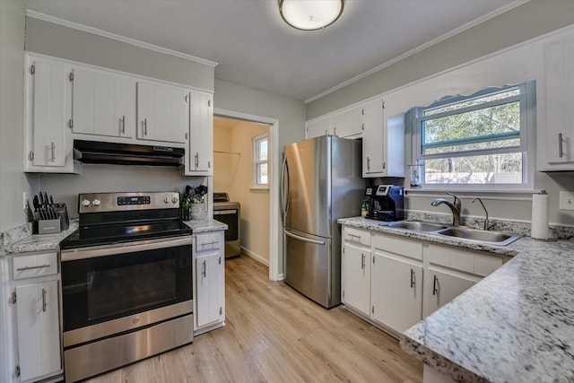 kitchen featuring light wood finished floors, a wealth of natural light, appliances with stainless steel finishes, a sink, and under cabinet range hood