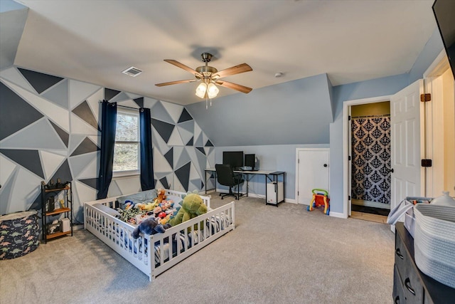 rec room featuring lofted ceiling, carpet floors, visible vents, a ceiling fan, and baseboards