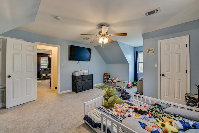 bedroom featuring carpet, lofted ceiling, visible vents, ceiling fan, and baseboards