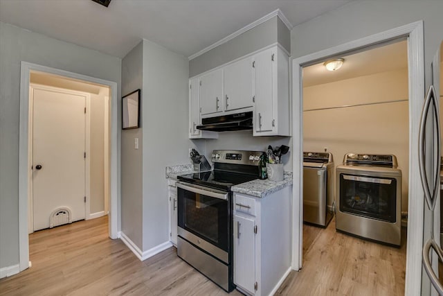 kitchen with separate washer and dryer, appliances with stainless steel finishes, light wood-type flooring, and under cabinet range hood