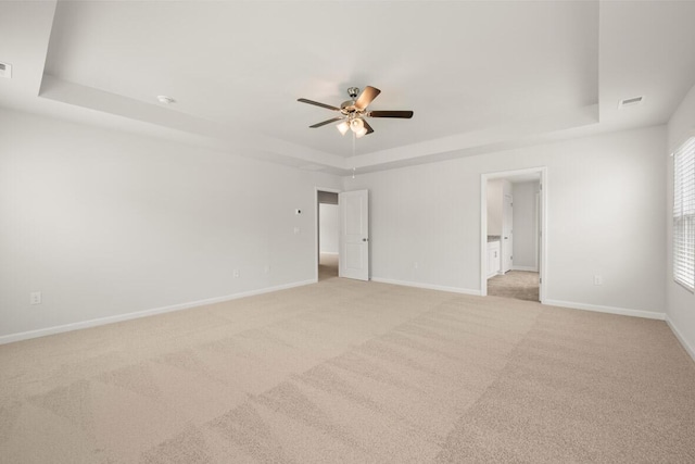 1256 Birch Cir, Grovetown, GA 30813 - spare room with a raised ceiling, ceiling fan, light colored carpet, and baseboards