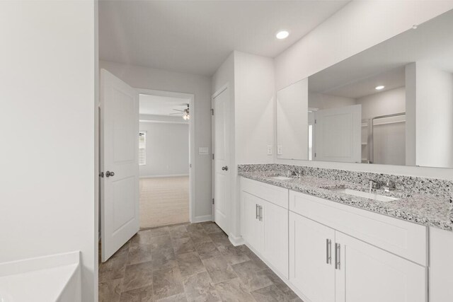 1256 Birch Cir, Grovetown, GA 30813 - bathroom with double vanity, ceiling fan, recessed lighting, a shower with shower door, and baseboards