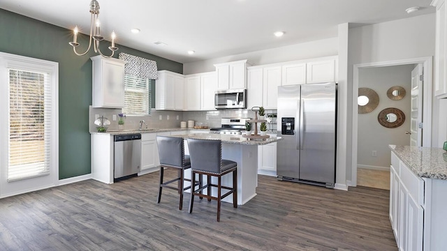 1256 Birch Cir, Grovetown, GA 30813 - kitchen featuring appliances with stainless steel finishes, white cabinets, decorative backsplash, dark wood-style floors, and recessed lighting