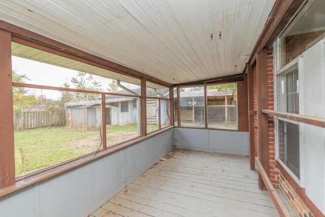 unfurnished sunroom featuring wooden ceiling