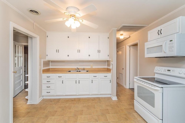 kitchen featuring white cabinetry, sink, ceiling fan, crown molding, and white appliances