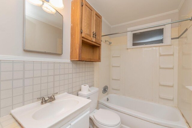 full bathroom with decorative backsplash, ornamental molding, shower / washtub combination, sink, and toilet