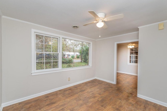 spare room featuring ceiling fan, wood-type flooring, and crown molding