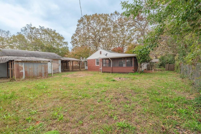 view of yard featuring a sunroom