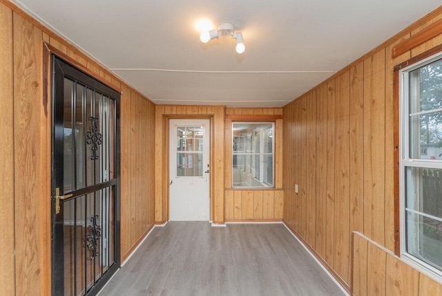 unfurnished sunroom featuring plenty of natural light