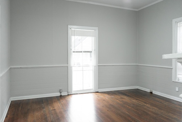 413 2nd St, Augusta, GA 30901 - empty room featuring dark wood finished floors, baseboards, ornamental molding, and a wainscoted wall