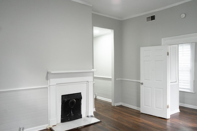 413 2nd St, Augusta, GA 30901 - unfurnished living room featuring dark wood-style flooring, baseboards, crown molding, wainscoting, and a fireplace with raised hearth